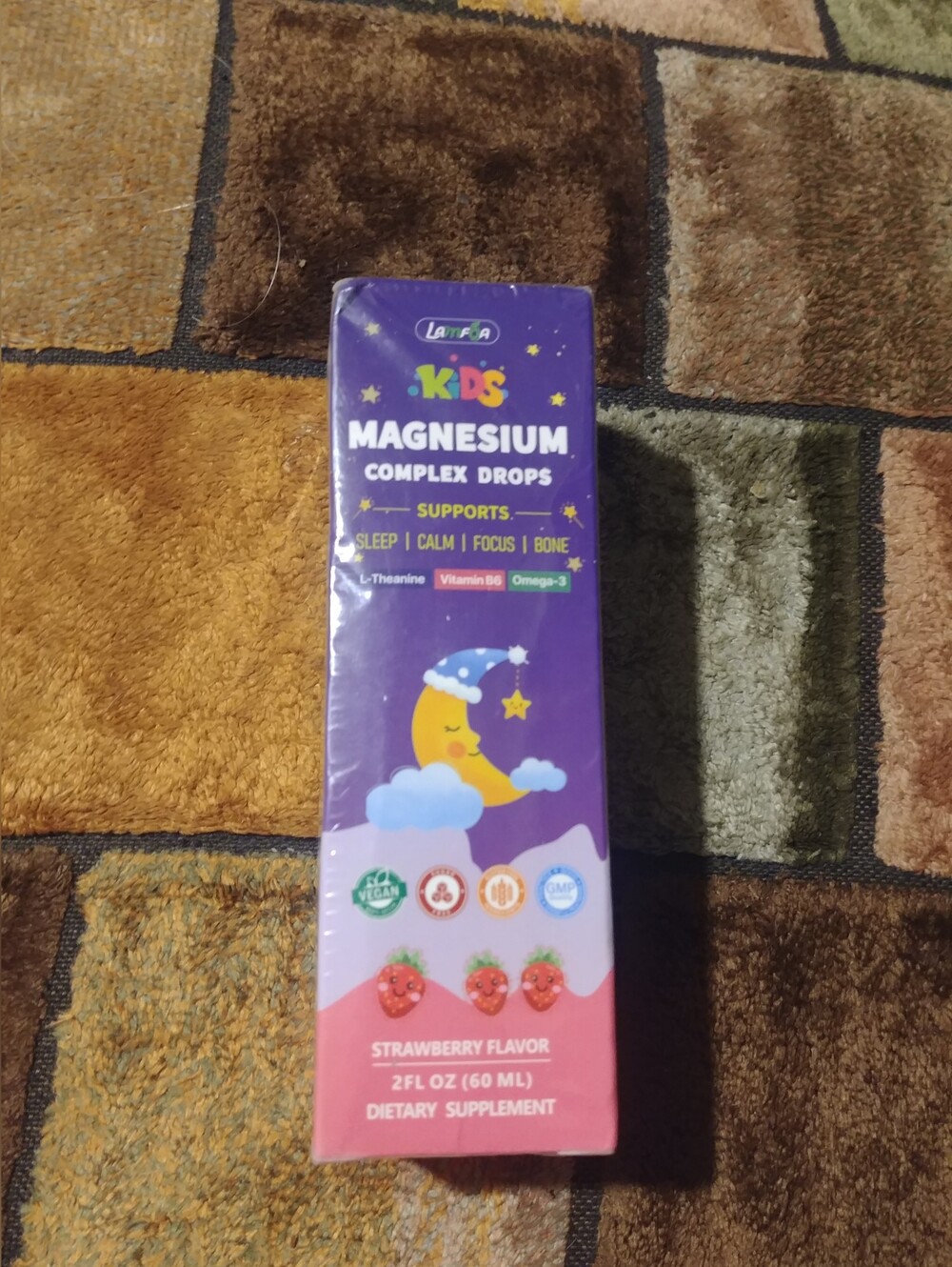 Kids Magnesium Complex Drops in strawberry flavor, indicating a 2 fl oz (60 mL)
